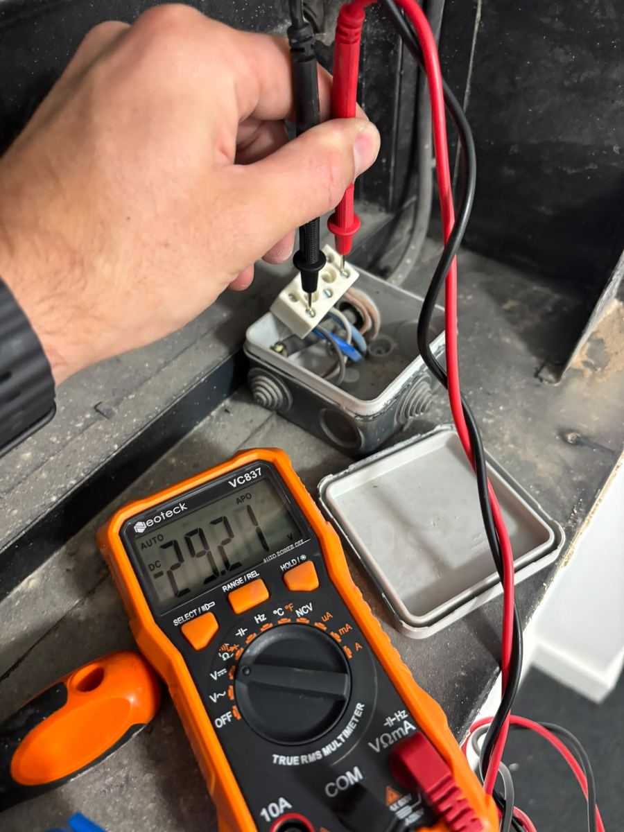 Engineer testing a circuit with a multimeter